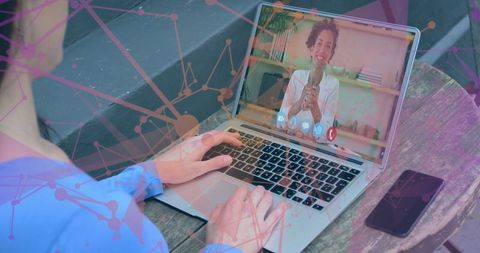 Remote Work: Tech-Savvy Individual Typing Laptop Communicating via Video Call