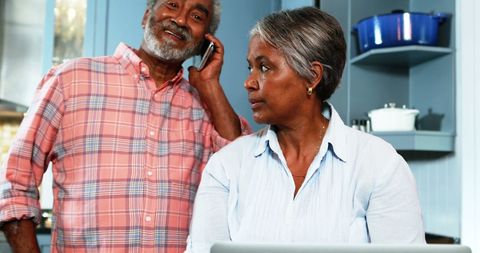 Senior Couple Engaging with Technology in Kitchen - Download Free Stock Images Pikwizard.com