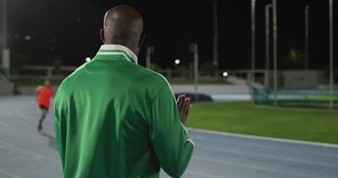 Coach Encouraging Disabled Athlete in Night Training at Track - Download Free Stock Images Pikwizard.com