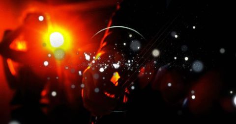 Guitarist silhouette strumming under red stage lights with dramatic bokeh glow