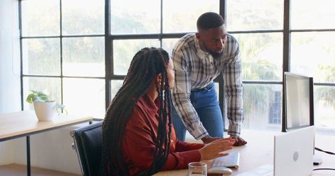 Collaborative teamwork at modern office workspace