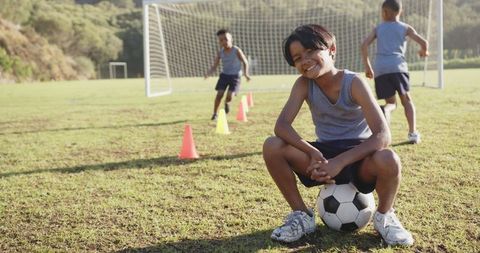 Youth Soccer Practice in Sunlit Field Enthusiasms