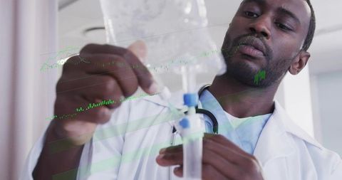 Focused clinician adjusting iv infusion bag and tubing with stethoscope close-up