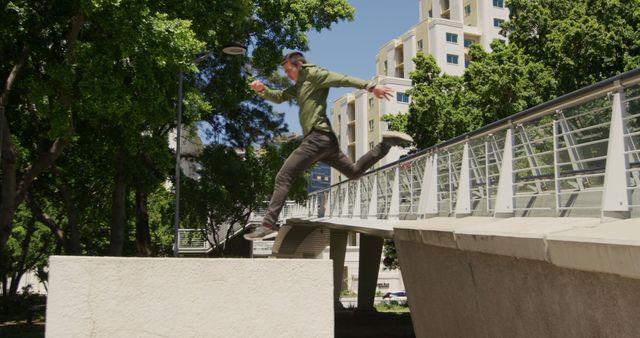 Man Parkour Jumping over Urban Obstacle - Download Free Stock Images Pikwizard.com