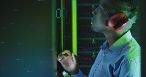 Engineer Monitoring Servers with Binary Code Data - Download Free Stock Images Pikwizard.com