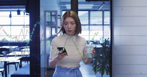 Businesswoman Engaged with Financial Charts on Smartphone