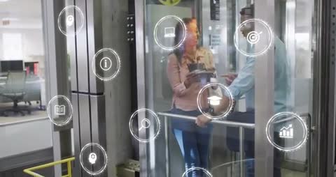 Business Colleagues Collaborating in Elevator with Digital Icons