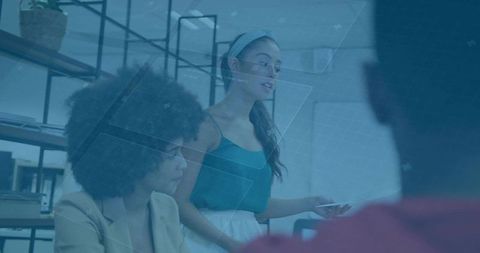 Young Professional Presenting in Modern Office with Digital Overlay