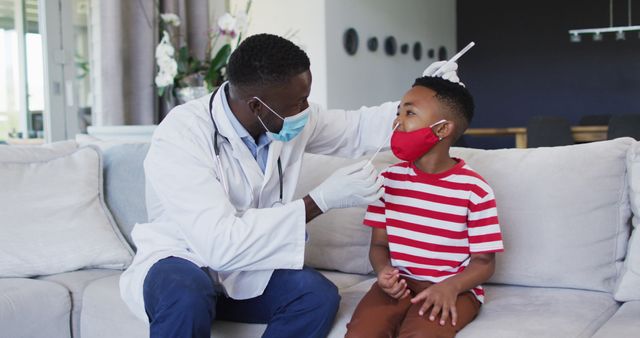 Doctor Examining Young Boy's Throat at Home Visit - Download Free Stock Images Pikwizard.com