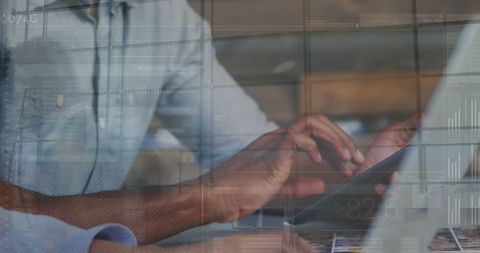 Coworkers collaborate using digital technology in modern office