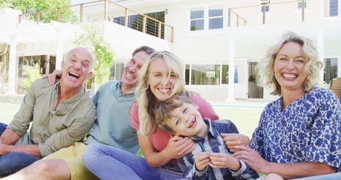 Happy Family Embracing in Sunny Garden