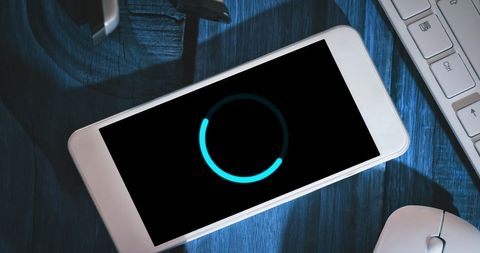 Loading Screen on Smartphone with Office Items in Background - Download Free Stock Images Pikwizard.com