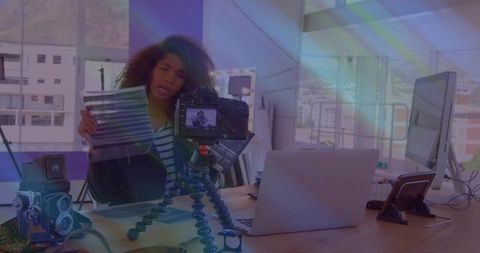 Content creator demonstrating color gels for photography