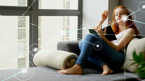 Young Woman Relaxing with Tablet in Modern Home Setting