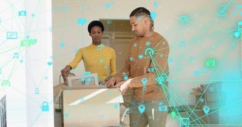 Couple unpacking smart home devices while navigating augmented reality network overlay