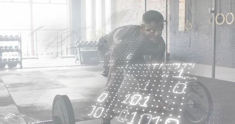Man gripping loaded barbell in industrial gym with binary data overlay for fitness tech concept