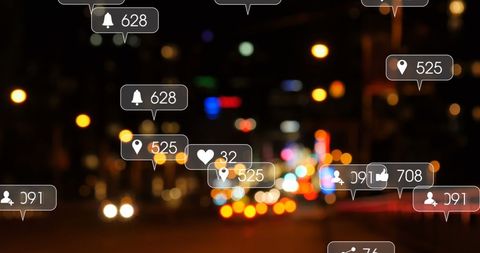 Social Media Icons Over Blurred City Traffic at Night