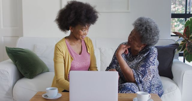 African Heritage Senior and Young Woman Conversing at Home with Laptop - Download Free Stock Images Pikwizard.com