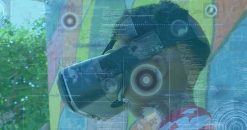 Young boy experiencing virtual reality with technology overlay