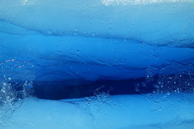 Close-Up of Deep Blue Ethereal Ice Layers and Bubbles - Download Free Stock Photos Pikwizard.com