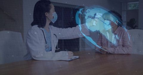 Telemedicine Consultation with Holographic Globe, Doctor Reaching Toward Virtual Patient