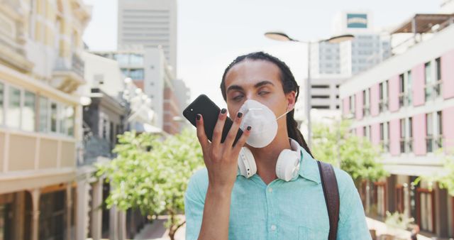 Young Man with Dreadlocks Using Smartphone Voice Command During City Walk - Download Free Stock Images Pikwizard.com