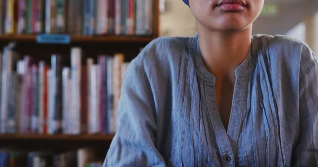 Young Woman Studying in Library Wearing Blue Shirt - Download Free Stock Images Pikwizard.com