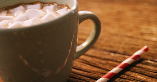 Cup of coffee with marshmallow on wooden table 4k