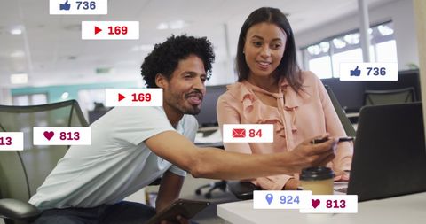 Coworkers Analyzing Social Media Metrics for Business Strategy