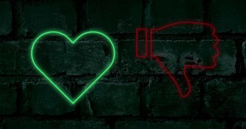 Neon Heart and Thumb Down on Brick Wall Symbolizing Choices - Download Free Stock Images Pikwizard.com