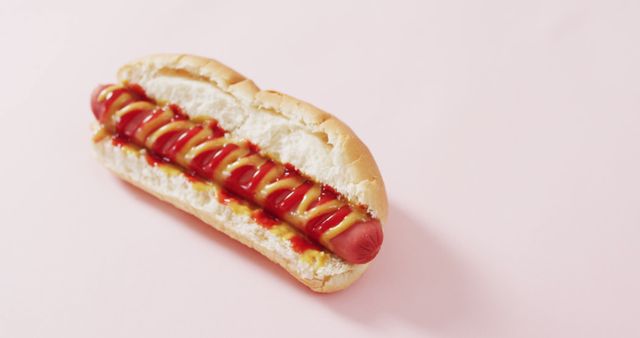 Image of hot dog with mustard and ketchup on a pink surface. food, cuisine and catering ingredients.
