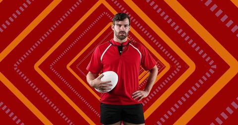 Confident Male Rugby Player Holding Ball with Geometric Background