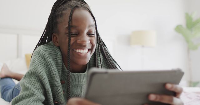 Happy Young Girl Using Tablet on Bed At Home - Download Free Stock Images Pikwizard.com