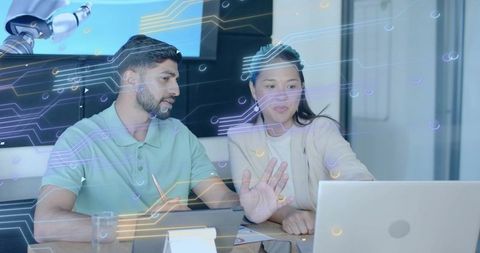 Tech Experts Analyzing Data in Futuristic Office with Digital Overlay