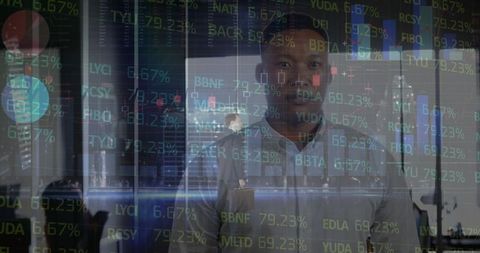 Business professional analyzing stock market data on digital screens