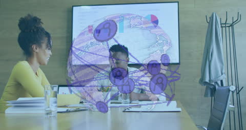 Business Networking Globe Overlay on Office Meeting