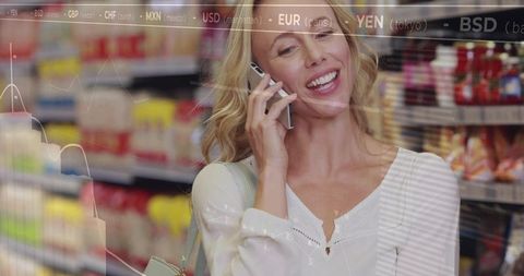 Smiling woman talking on smartphone in grocery aisle with financial chart and data overlay