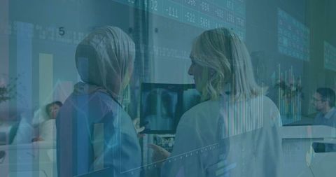 Medical professionals analyzing digital health data