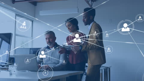 Diverse Team Analyzing Data Networks in Modern Office