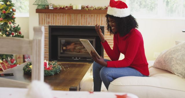 Woman in Santa Hat Video Calling Family at Christmas - Download Free Stock Images Pikwizard.com