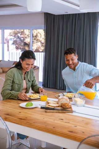 Diverse Couple Enjoying Healthy Breakfast at Home