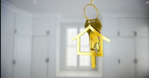 Golden Keys with House-Shape Keychain in Luxurious Interior