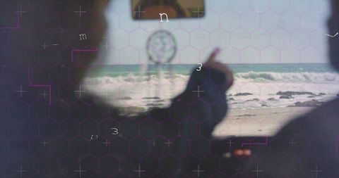 Peaceful beach view from car with dreamcatcher and ocean waves