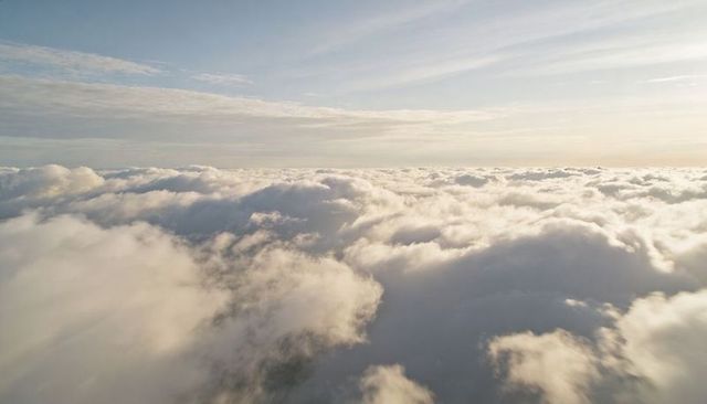 Sunlit Stratocumulus Sea Over Expansive High-Altitude Horizon Panorama with Soft Light