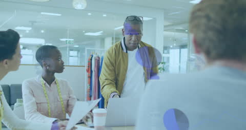 Diverse Team Discussing Project in Modern Office Environment