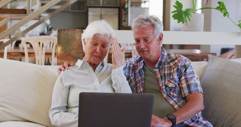Elderly Couple Video Chatting Relaxing on Couch - Download Free Stock Images Pikwizard.com