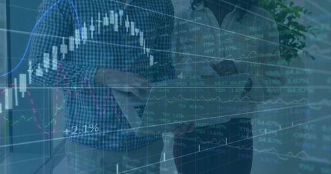 Business Professionals Analyzing Financial Data with Laptops in Modern Office