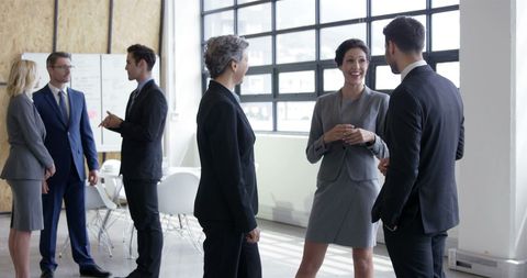Colleagues Engaging in Discussion in Modern Office Setting - Download Free Stock Images Pikwizard.com