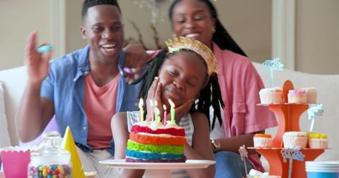 Joyful Family Birthday Celebration with Colorful Cake