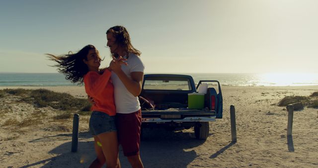 Young Couple Dancing on Beach Beside Pickup Truck at Sunset - Download Free Stock Images Pikwizard.com